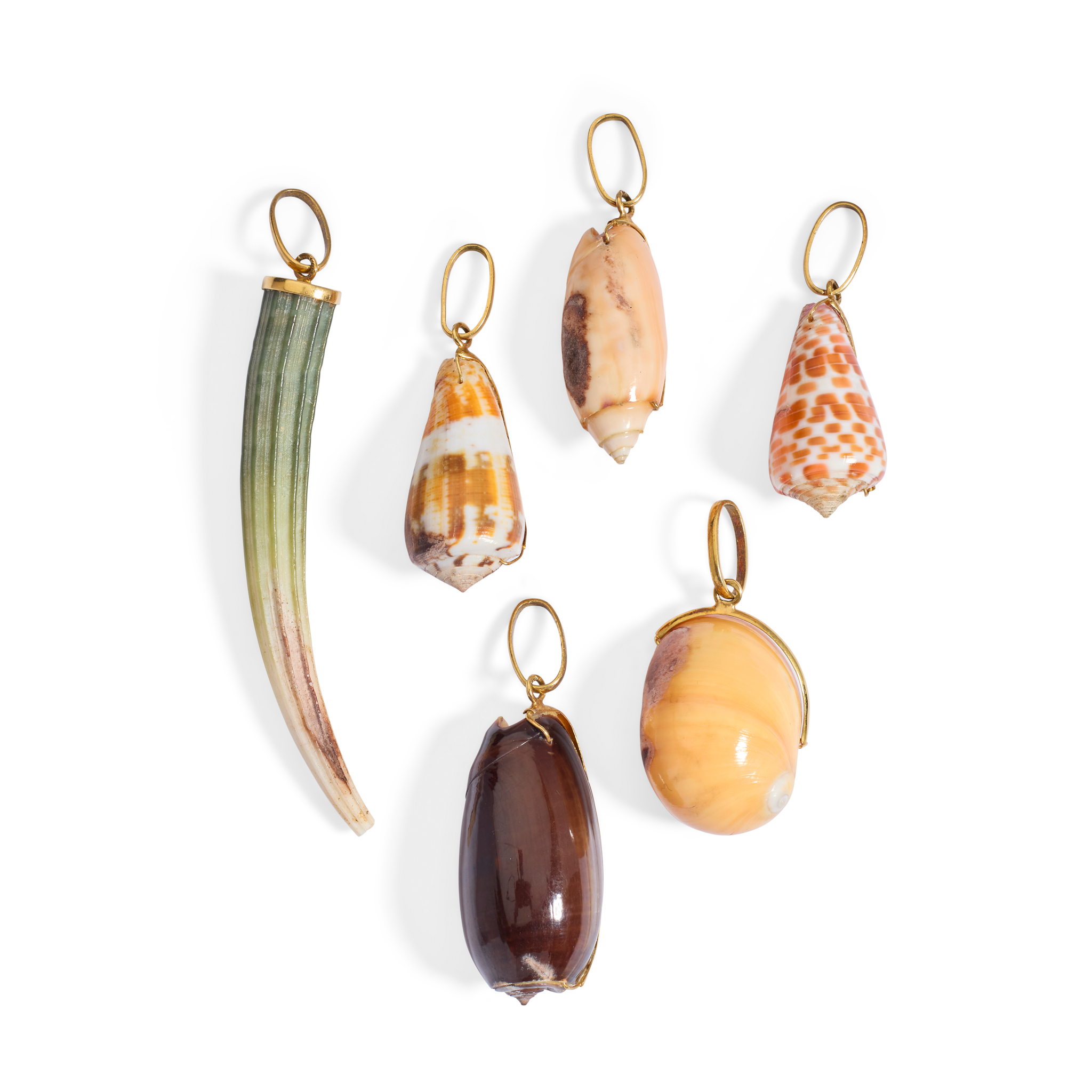 A collection of six shell pendants