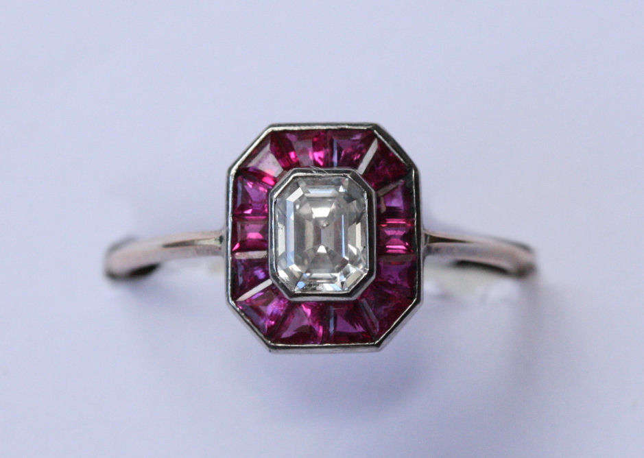 An Art Deco ruby and diamond set cluster ring