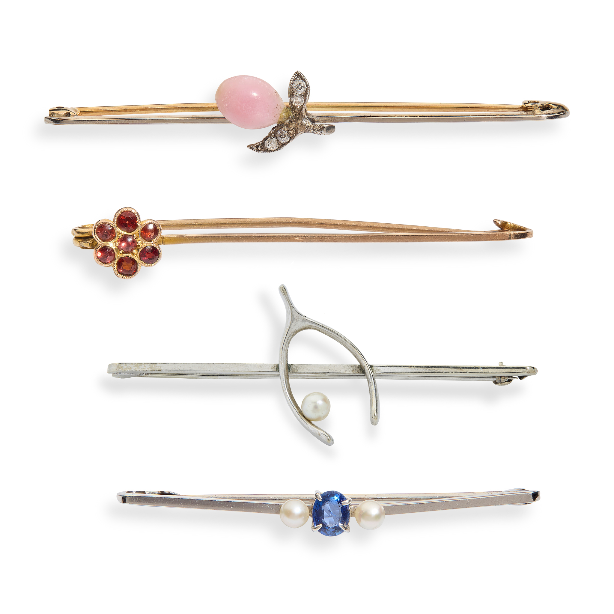 A collection of four brooches