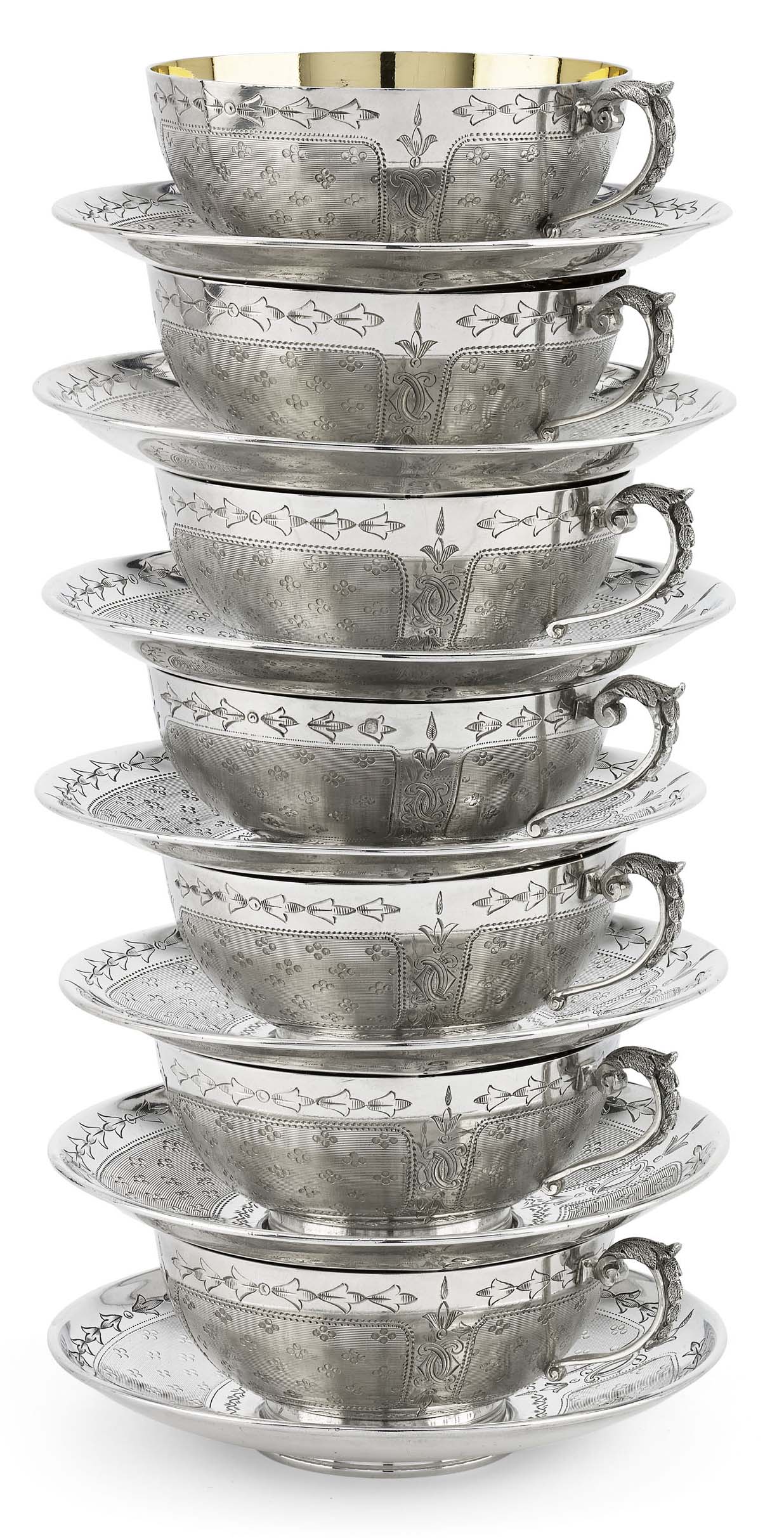 A scarce set of Victorian silver tea cups, coffee cans and saucers