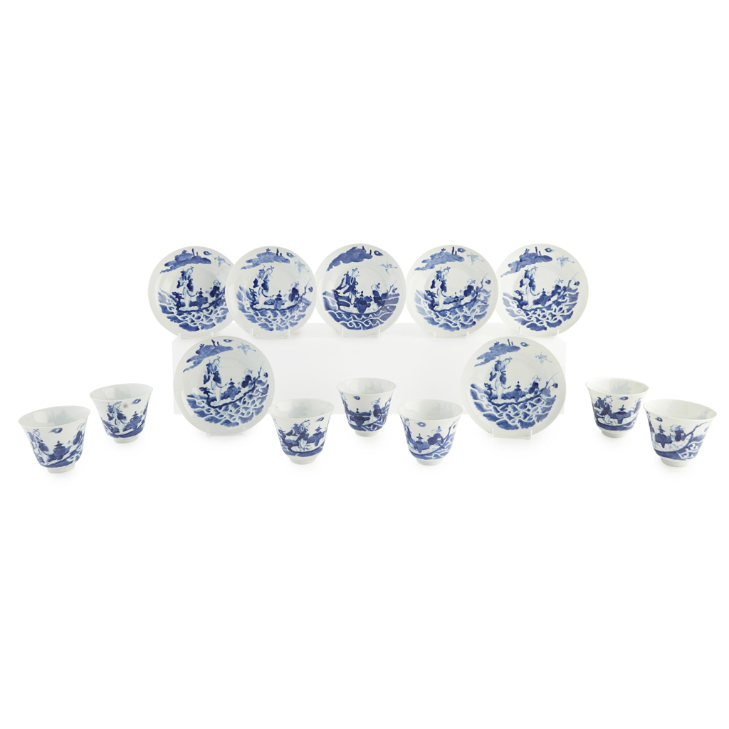 SET OF SEVEN BLUE AND WHITE CUPS AND SAUCERS