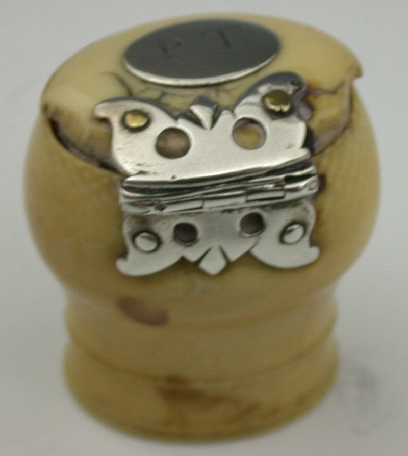 A mid 18th century ivory capstan snuff mull