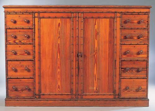 A Victorian pitch pine and faux bamboo decorated part bedroom suite by Howard and Sons, London