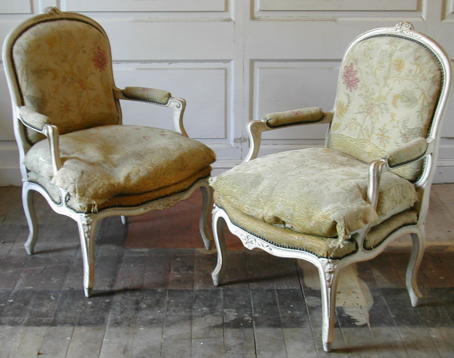 A pair of Louis XV style overpainted fauteuils,