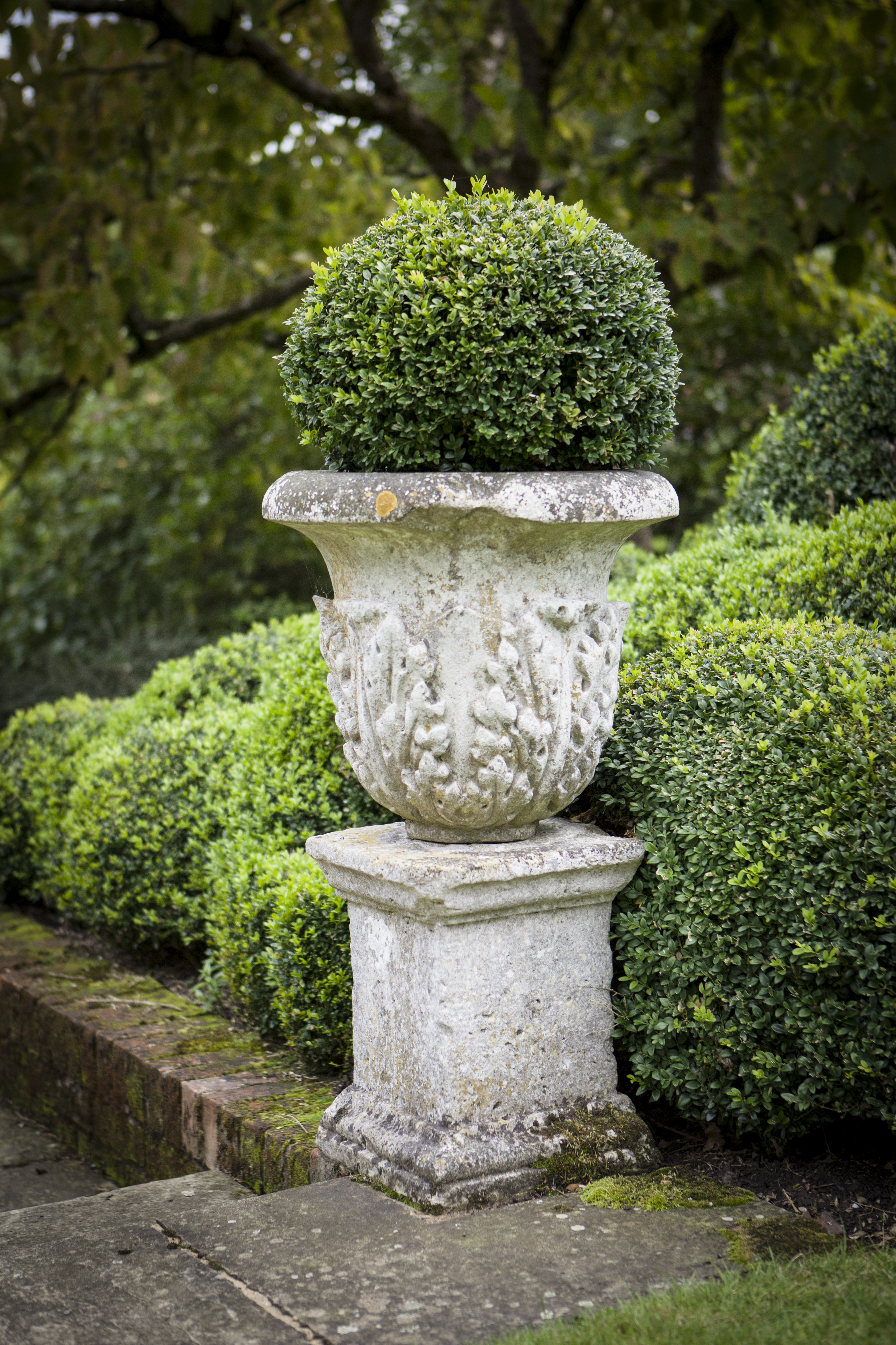 SET OF THREE STONE BALUSTERS URNS