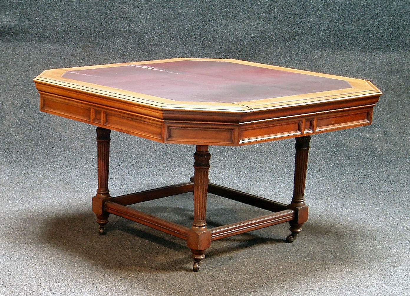 A 20th century mahogany octagonal library table,