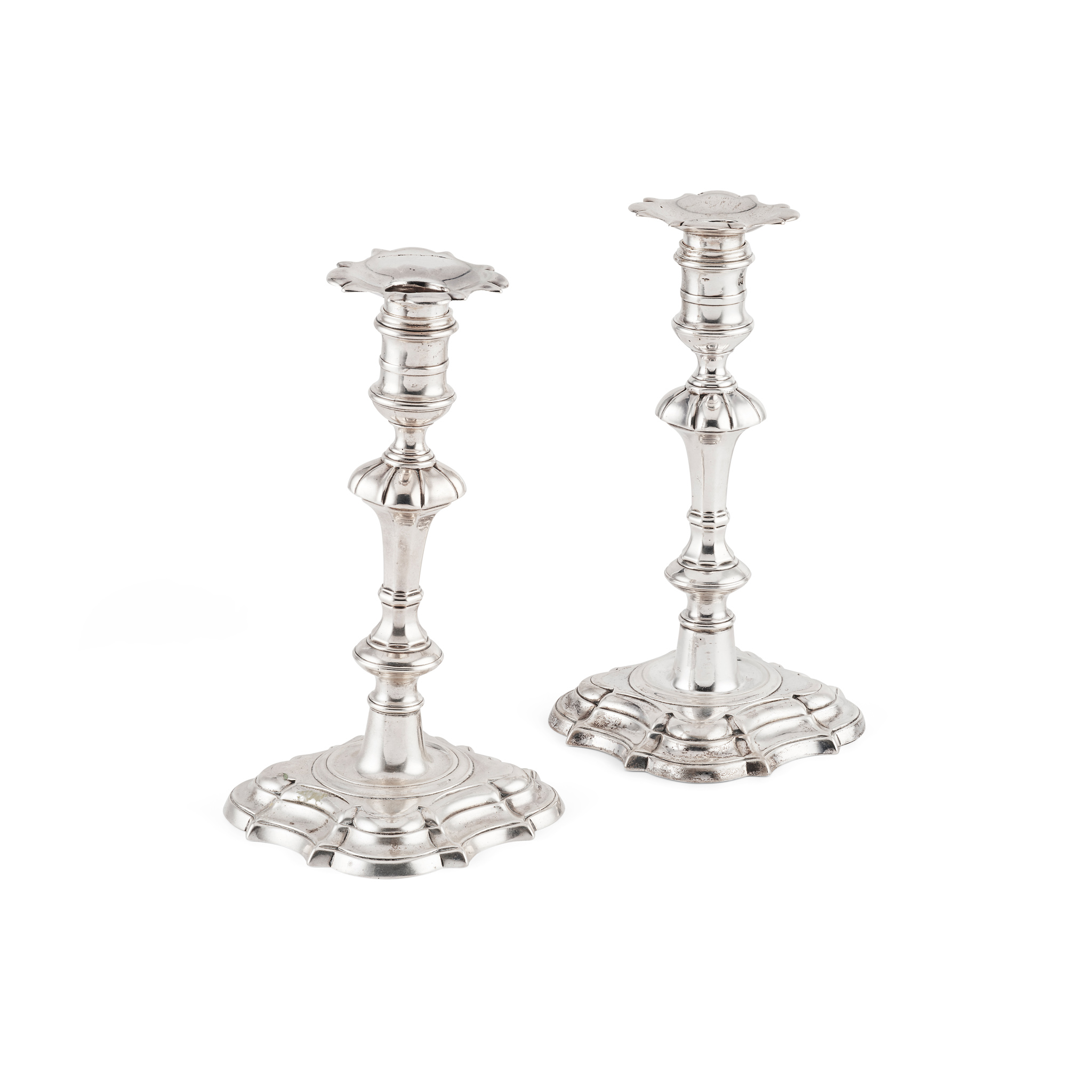 A PAIR OF GEORGE II CAST CANDLESTICKS