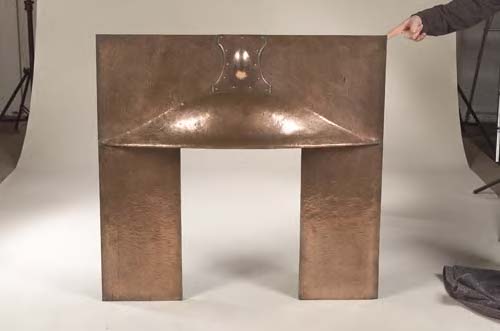 A Scottish Art Nouveau copper fire surround,
