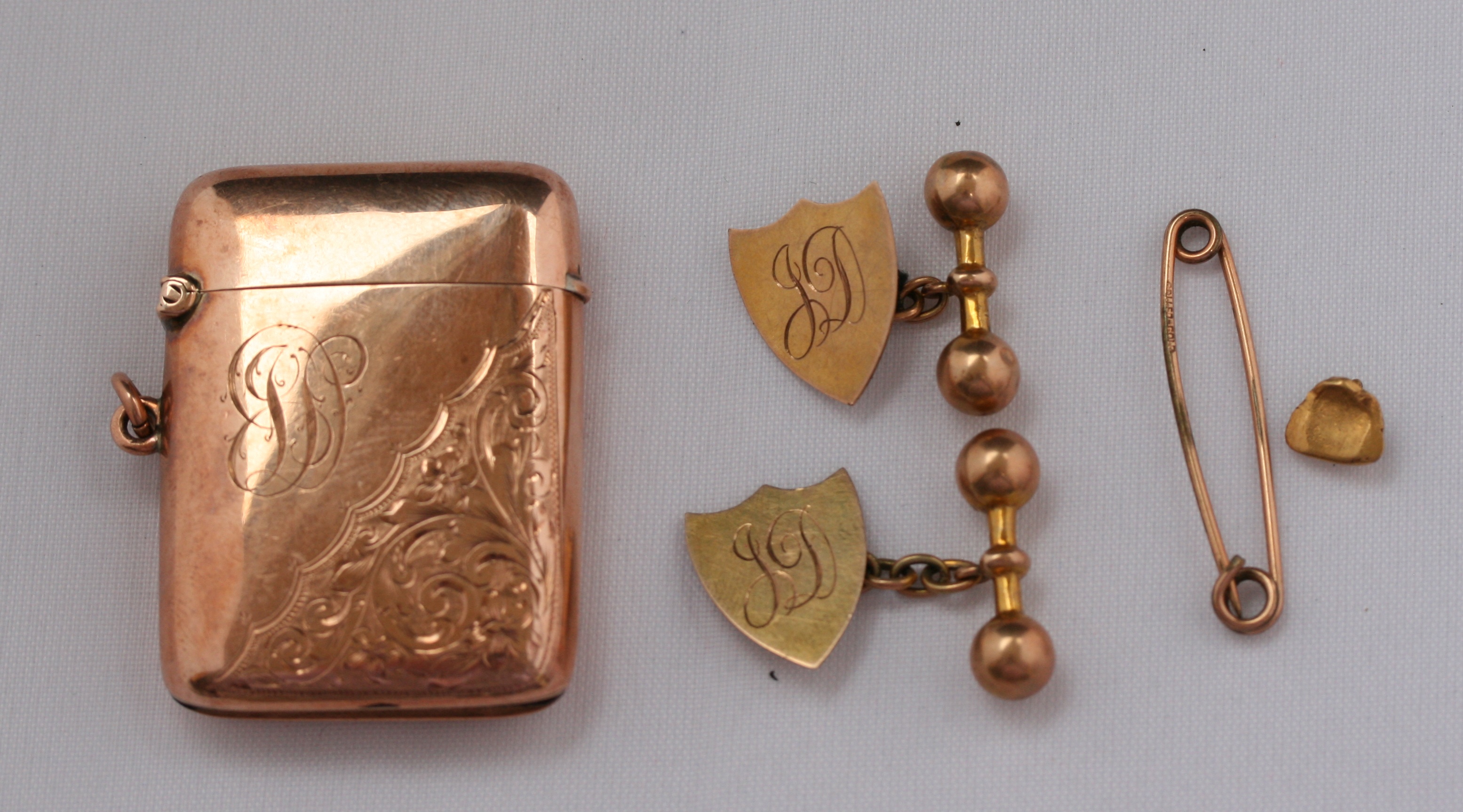 A pair of gold cufflinks