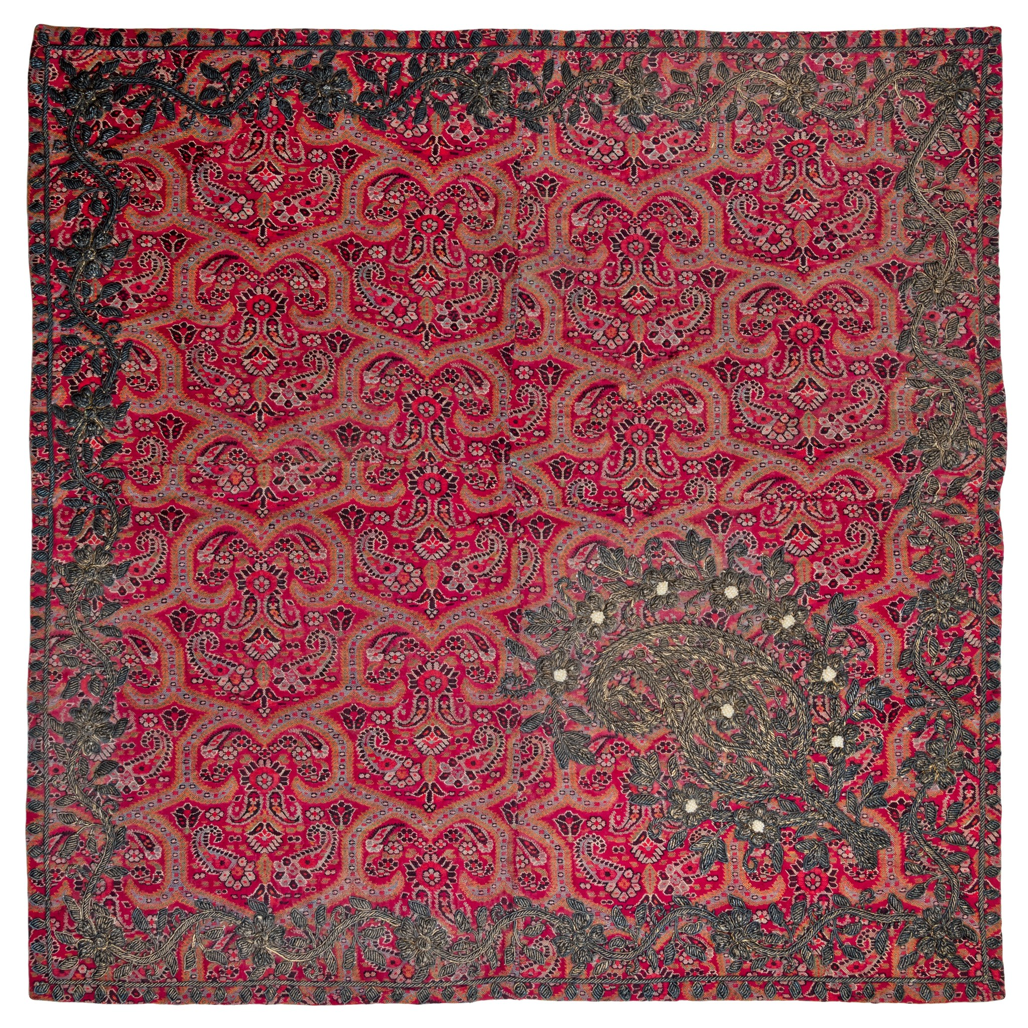 A QAJAR GILT METAL AND PEARL EMBROIDERED WOOL 'TERMEH' PANEL