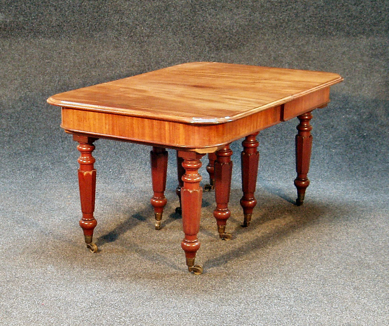A Victorian mahogany extending dining table table