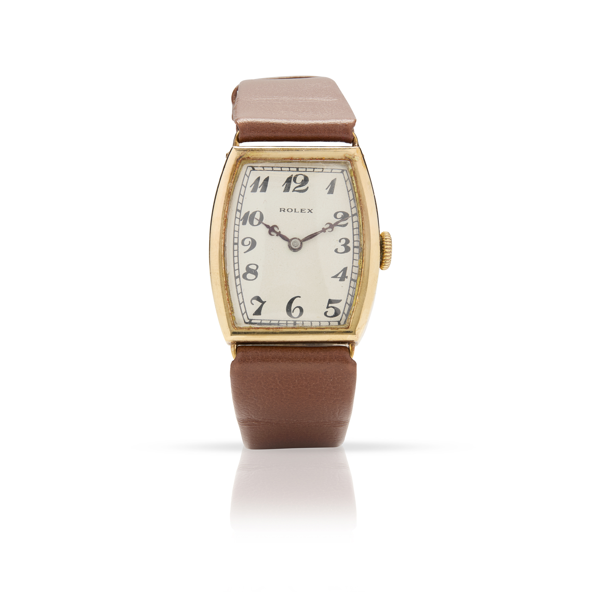 Rolex. A fine 9k gold mechanical tonneau shape wristwatch with Rolex presentation box