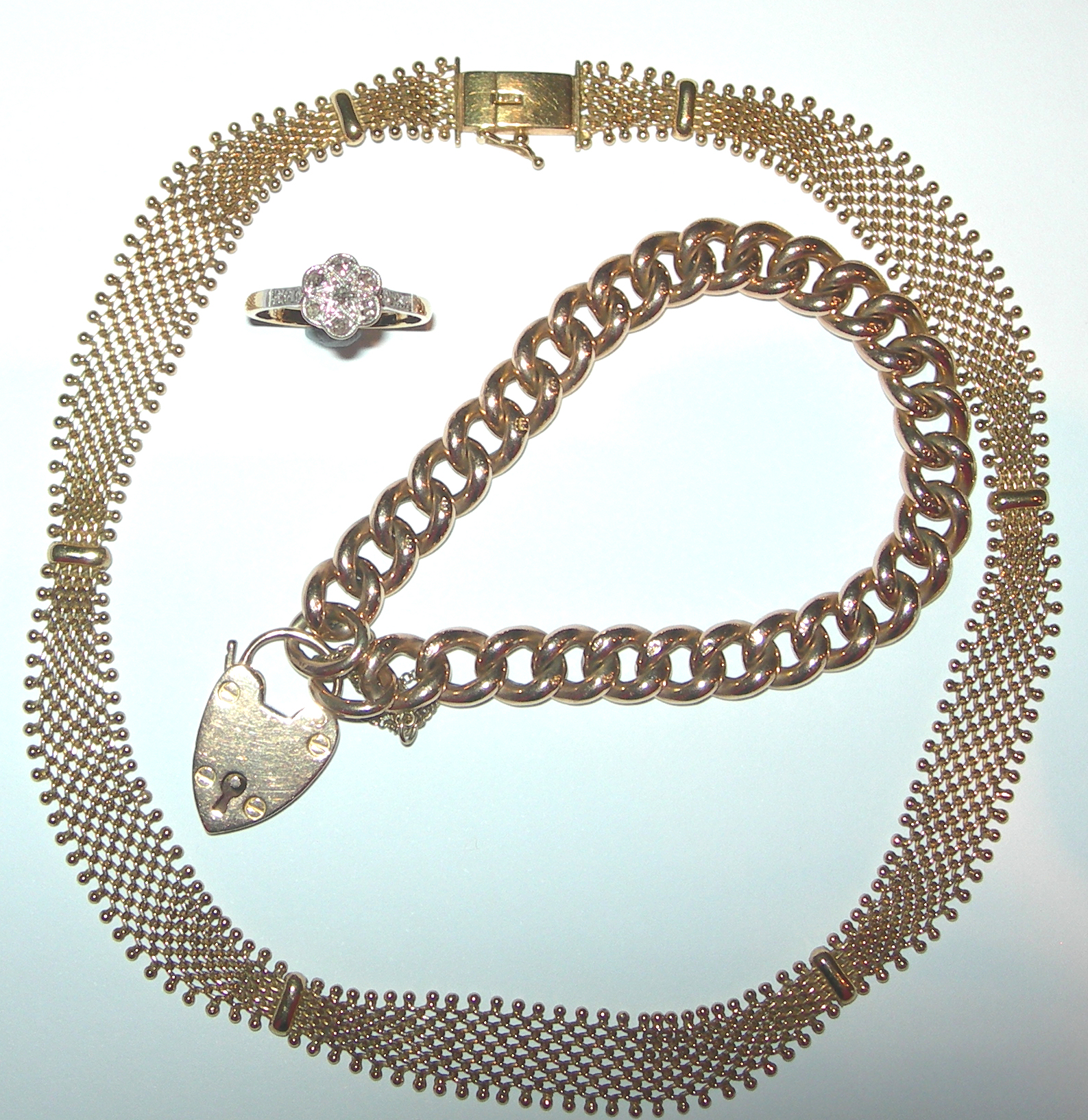 An 18ct gold and platinum mounted diamond floral cluster ring,