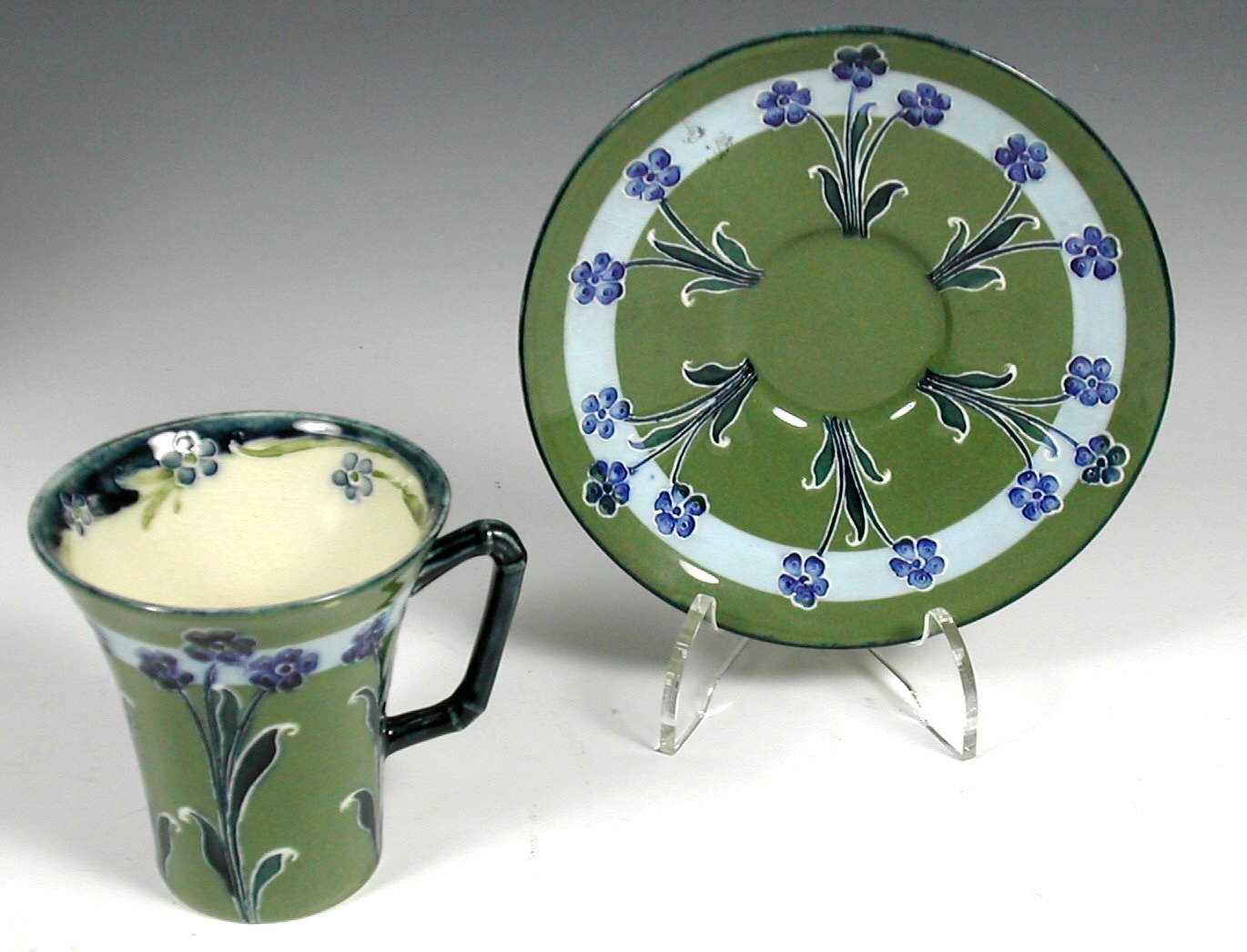 A Moorcroft cabaret cup and saucer,