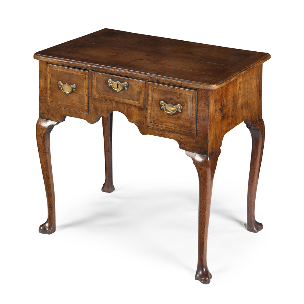 A GEORGE II WALNUT CROSSBANDED LOWBOY