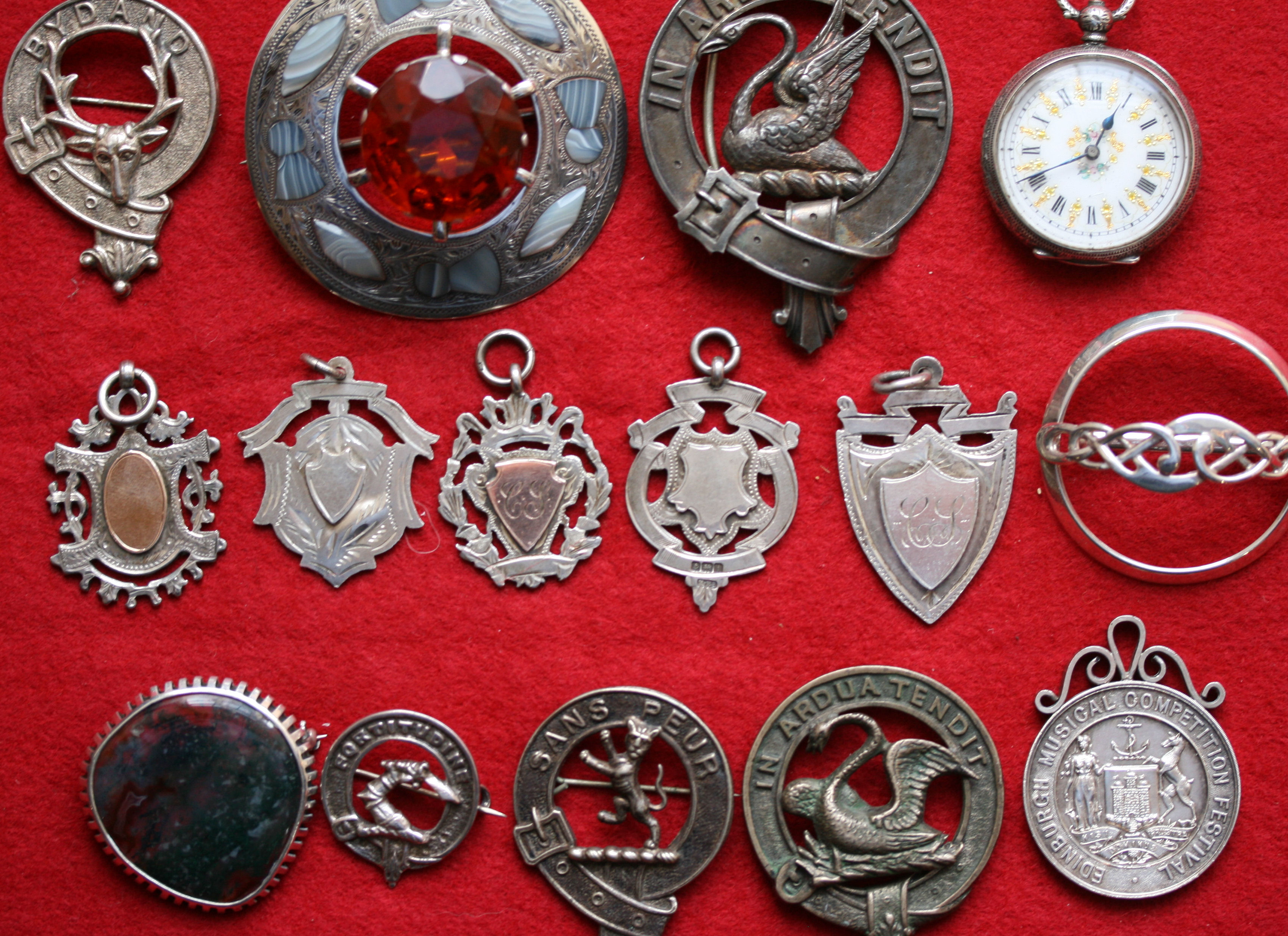 A collection of silver medal fobs