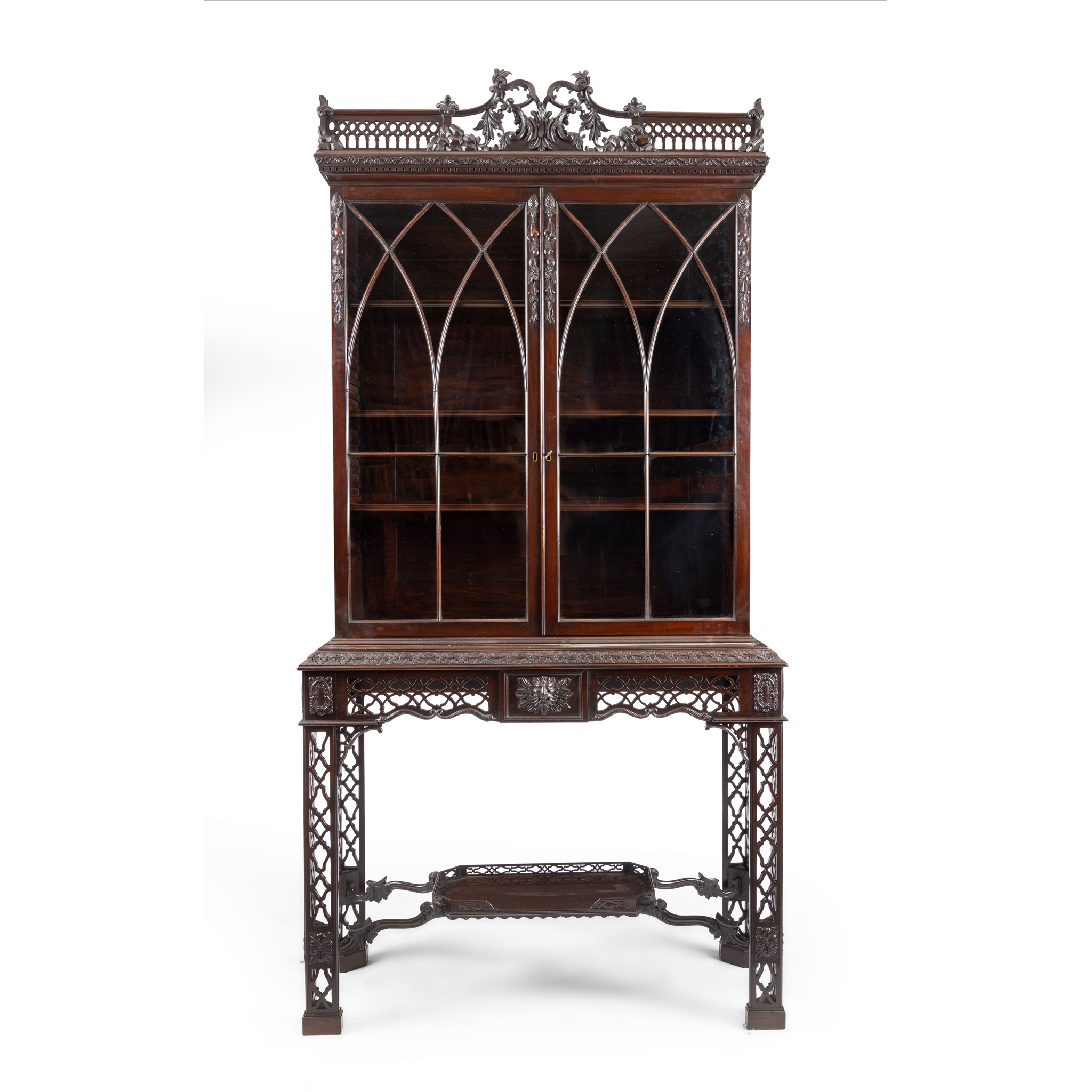 A MAHOGANY BOOKCASE ON STAND IN THE CHIPPENDALE STYLE