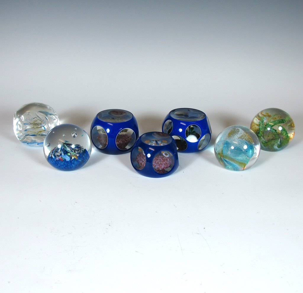A group of glass paper weights