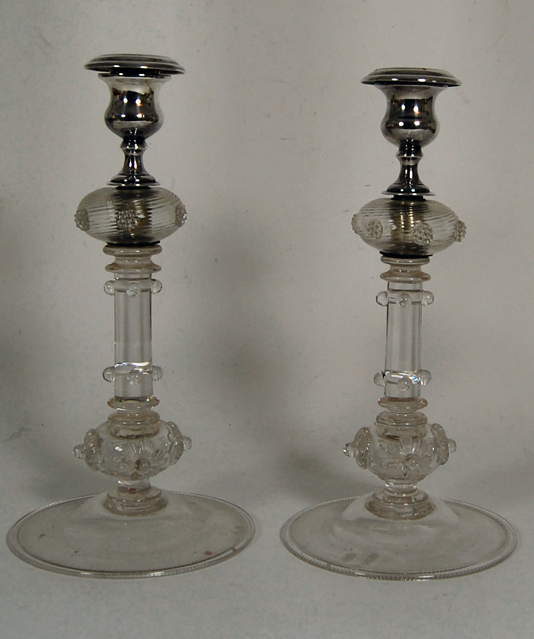 A pair of continental mounted glass candlesticks