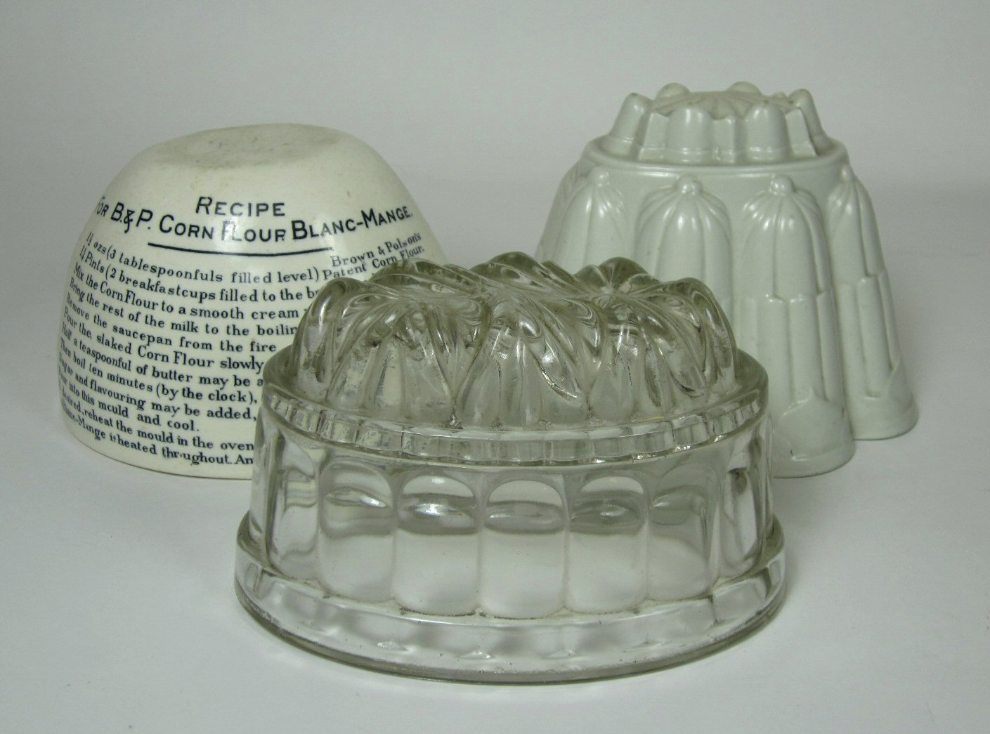 COLLECTION OF CERAMIC AND GLASS JELLY MOULDS
