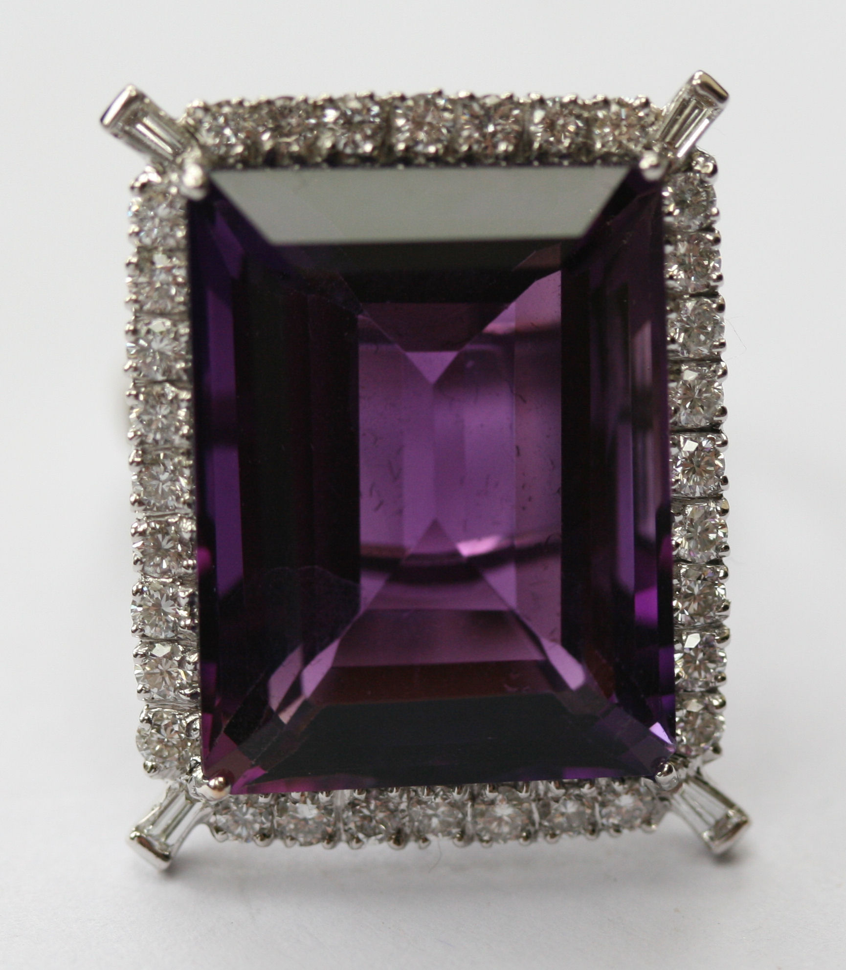 An 18ct white gold mounted amethyst and diamond set cocktail ring