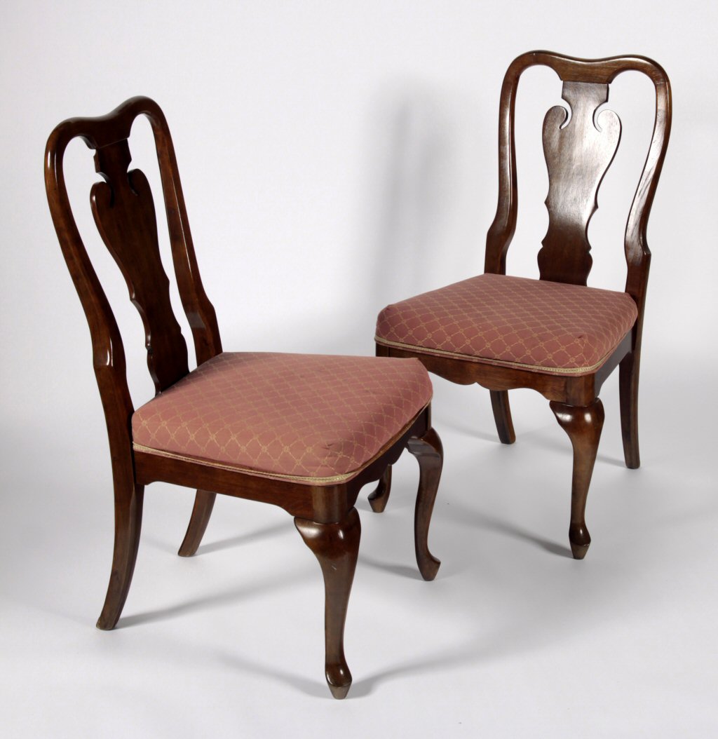 A set of twelve George II style mahogany dining chairs