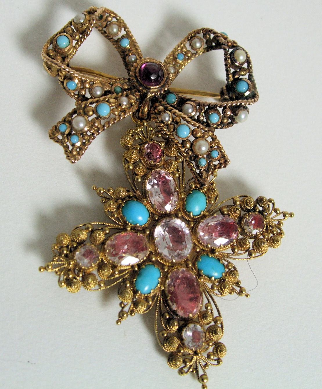 A gold, turquoise and gem set bow brooch and an associated suspension brooch
