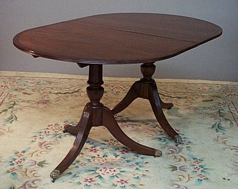 A Regency style mahogany twin pedestal dining table