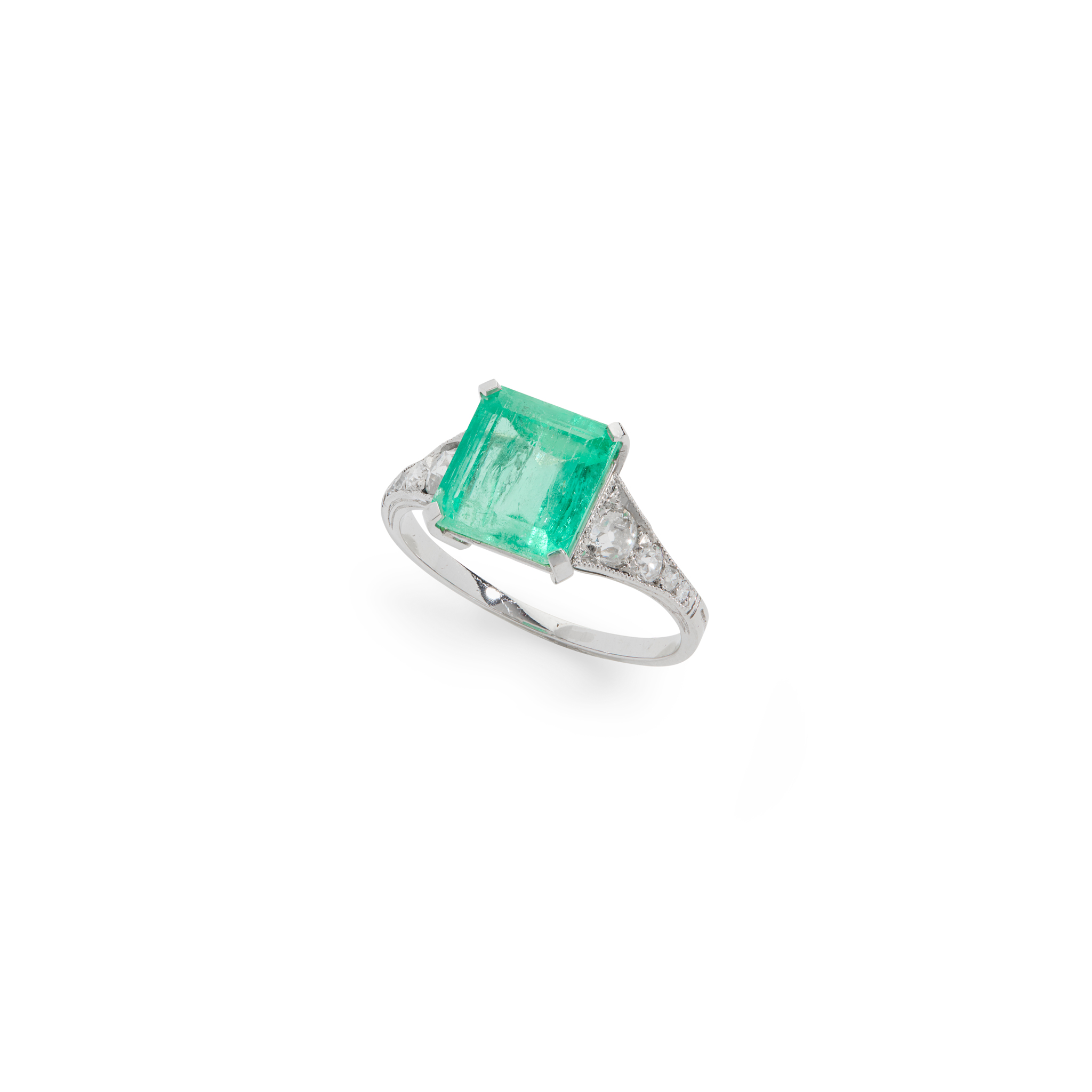 A emerald and diamond dress ring