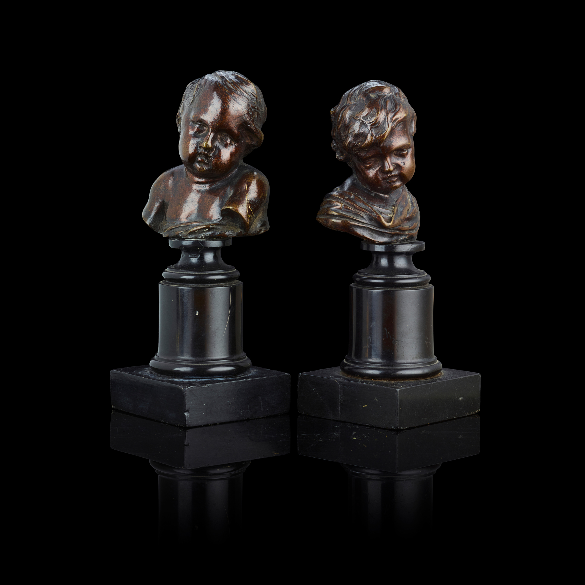 A PAIR OF ITALIAN BRONZE BUSTS OF PUTTI, AFTER FRANCOIS DUQUESNOY