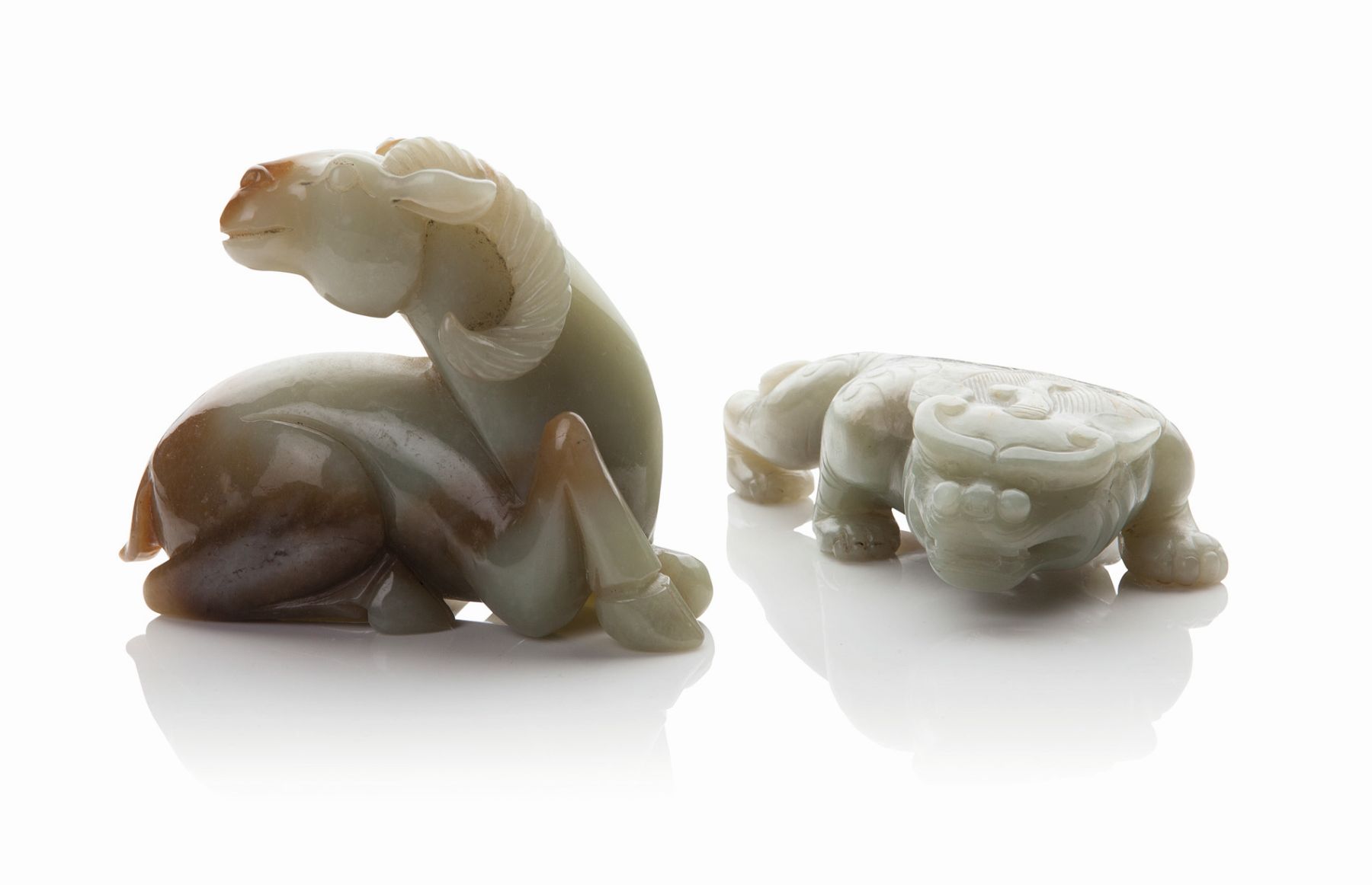 TWO CHINESE JADE CARVINGS OF MYTHICAL BEASTS