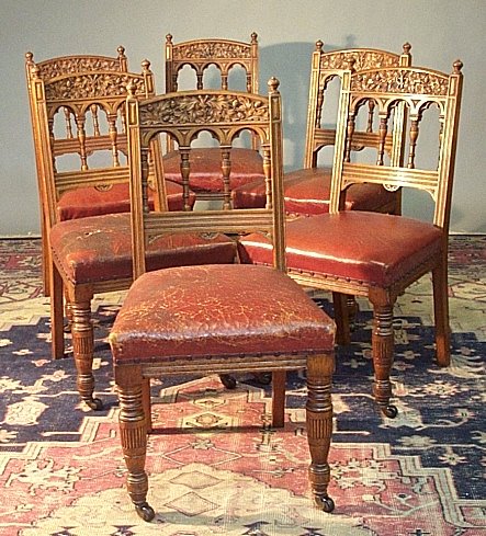 A set of six Edwardian oak side chairs