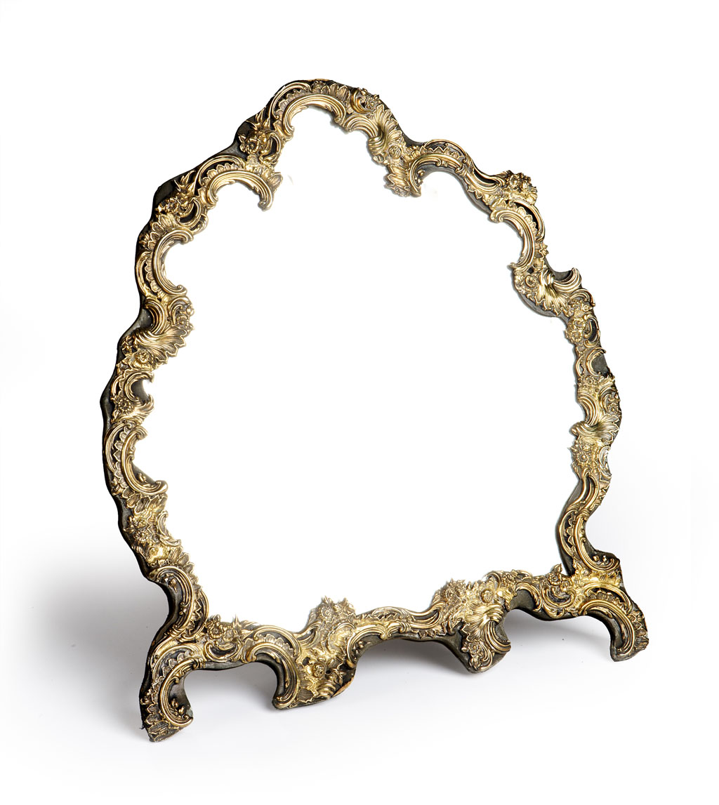 An Edwardian silver-gilt-mounted easel mirror William Comyns, London 1905