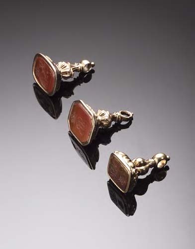 A collection of three gold mounted fob seals,