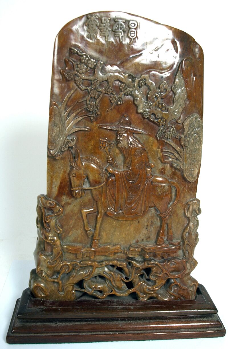 A Chinese hardstone carved panel depicting Zhang Kuo Lao