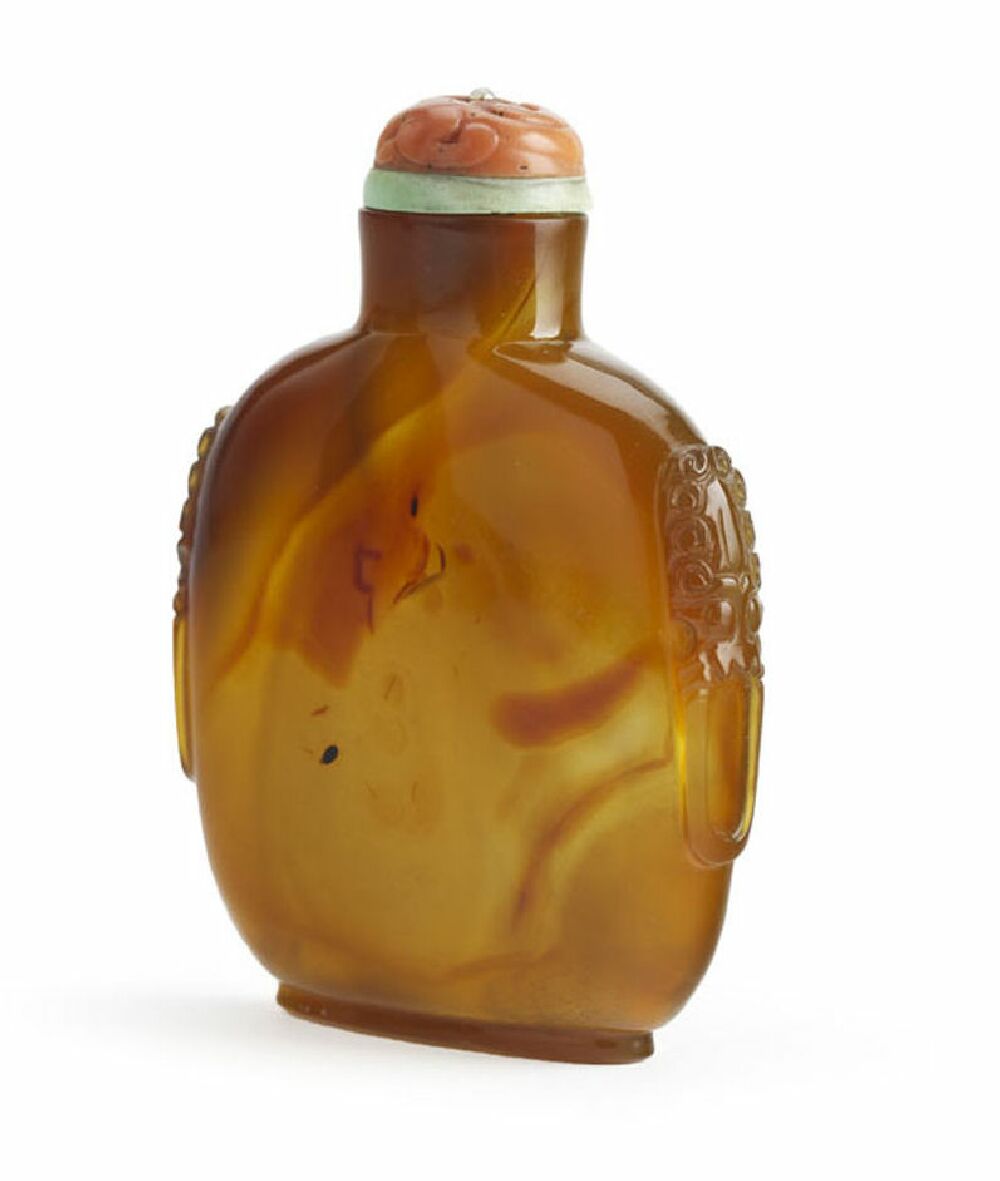 A Chinese twin handled amber agate snuff bottle