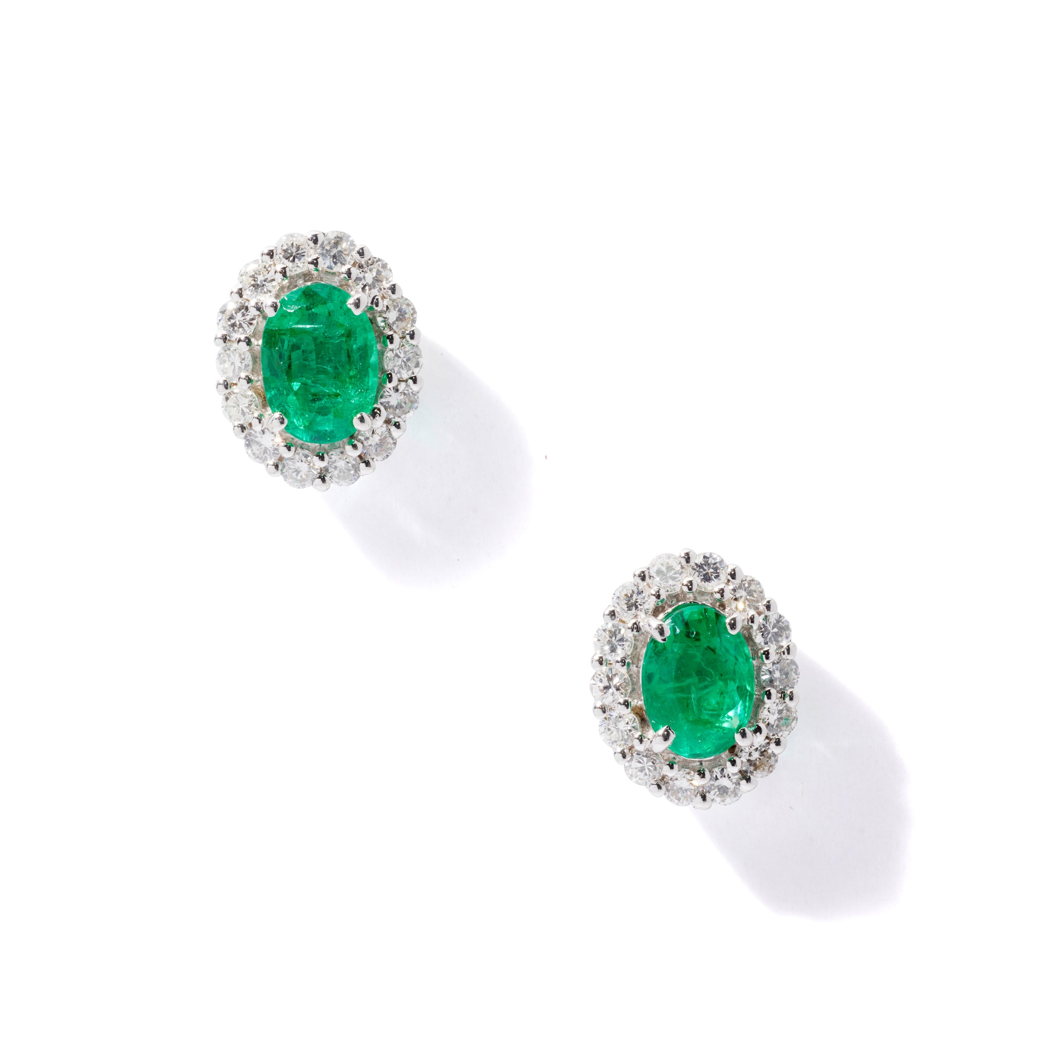 A pair of emerald and diamond cluster earrings