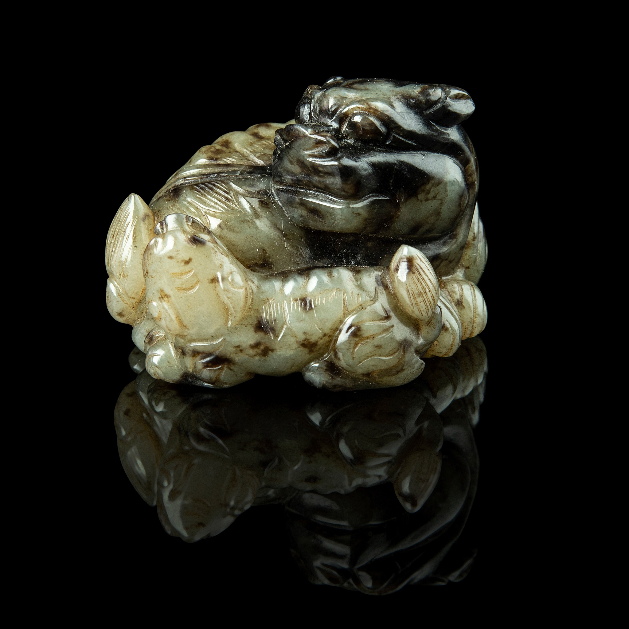 PALE CELADON JADE CARVING OF A QILIN AND CUB