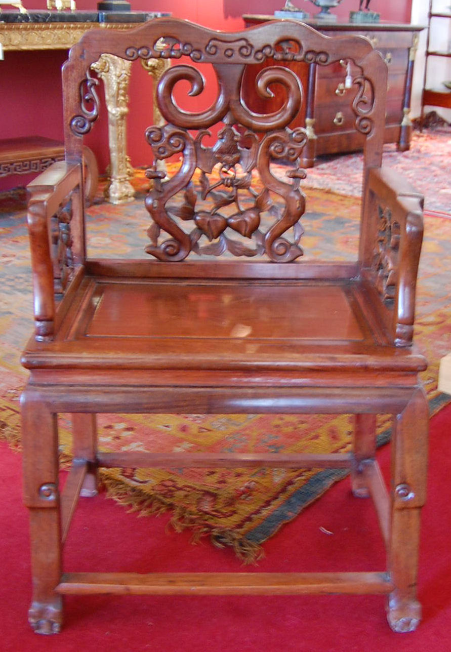 A pair of Chinese carved huang huali wood armchairs
