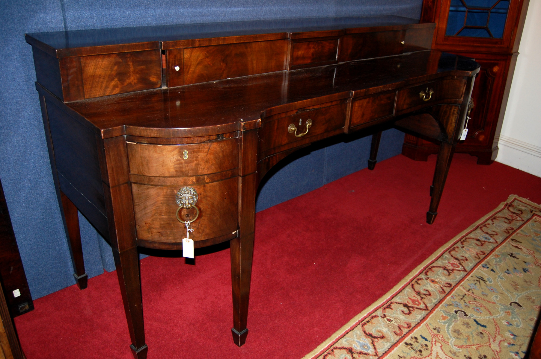 A George III mahogany inverted breakfront sideboard
