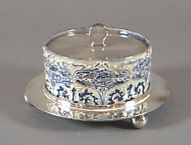 A Florian Ware cylindrical butter dish