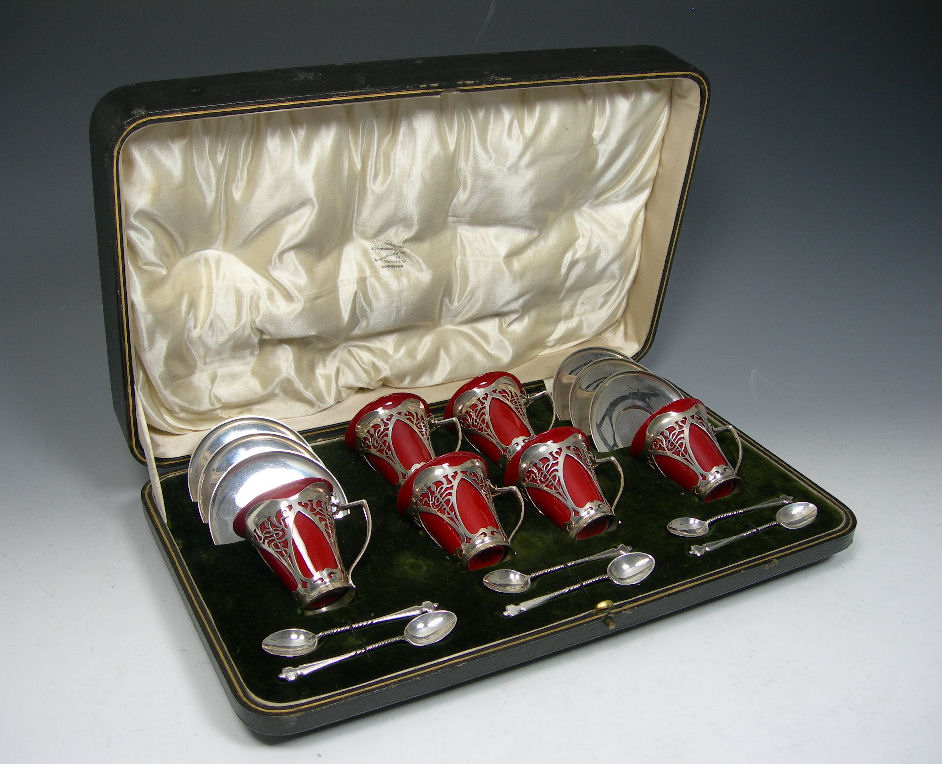 A cased mounted coffee set,