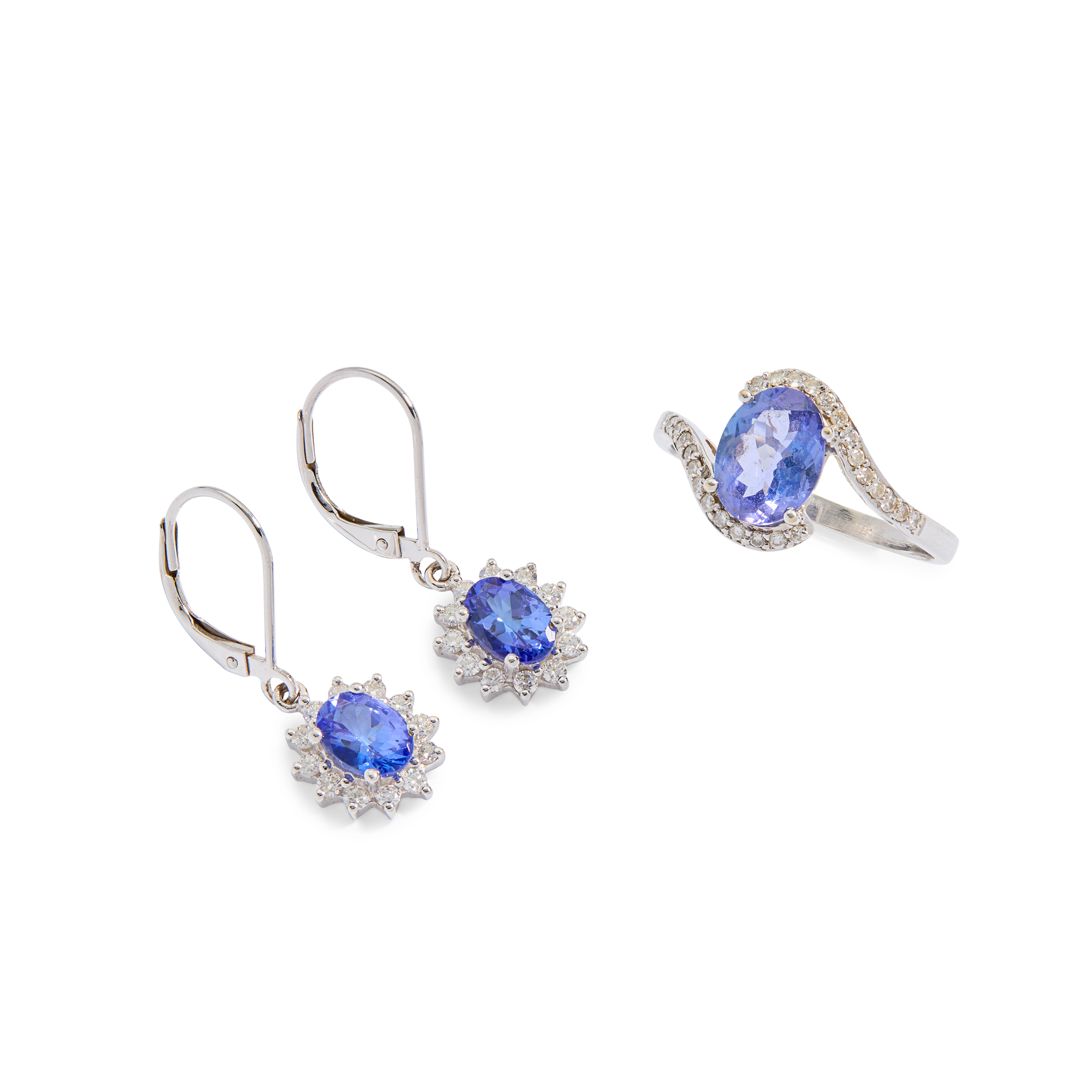 An 18ct gold Tanzanite and diamond ring with matched earrings
