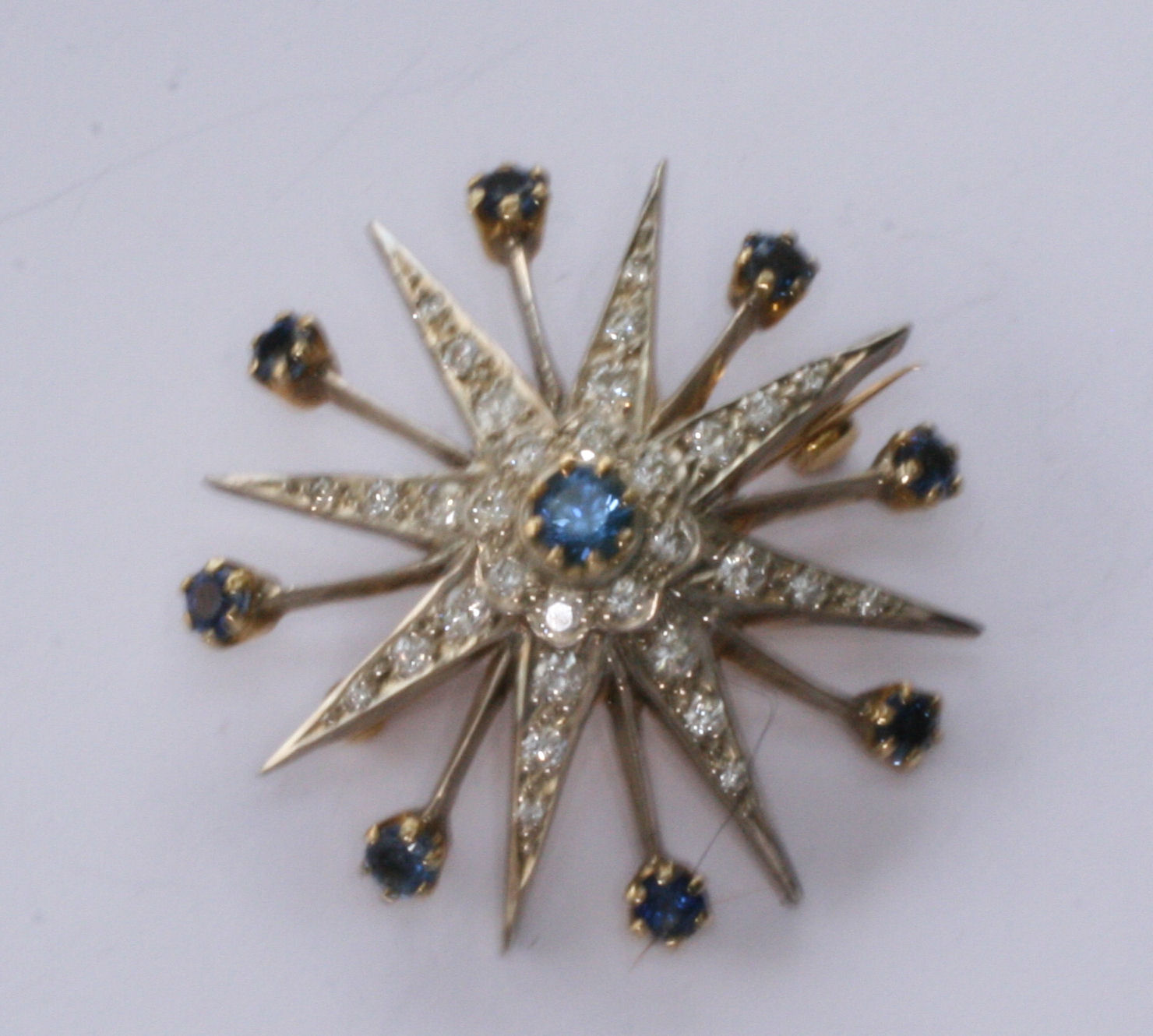 A Victorian style sapphire and diamond brooch