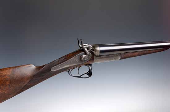 A double barrel 12 bore thumb hole action hammer gun