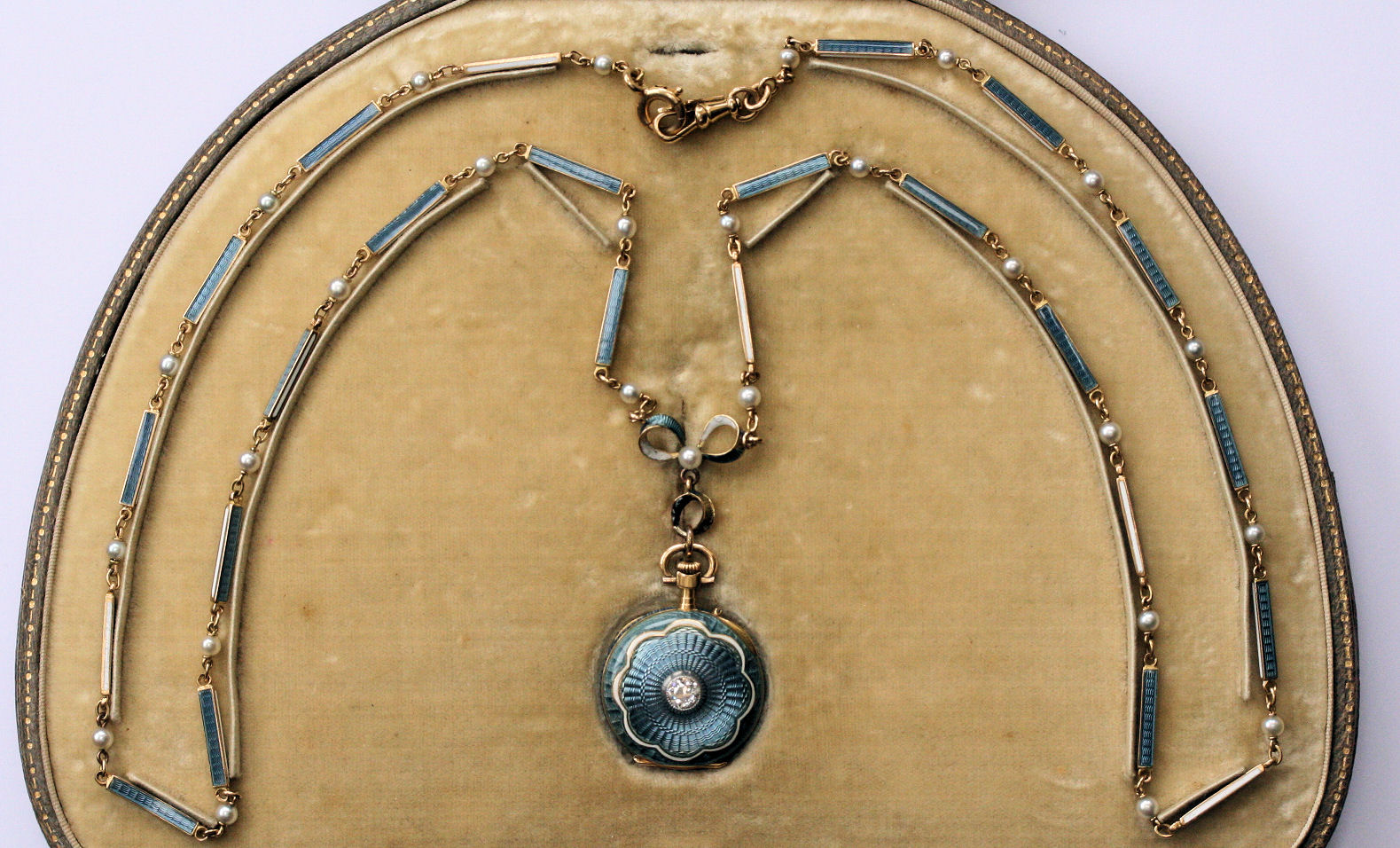 An Edwardian diamond set and enamelled fob watch with chain