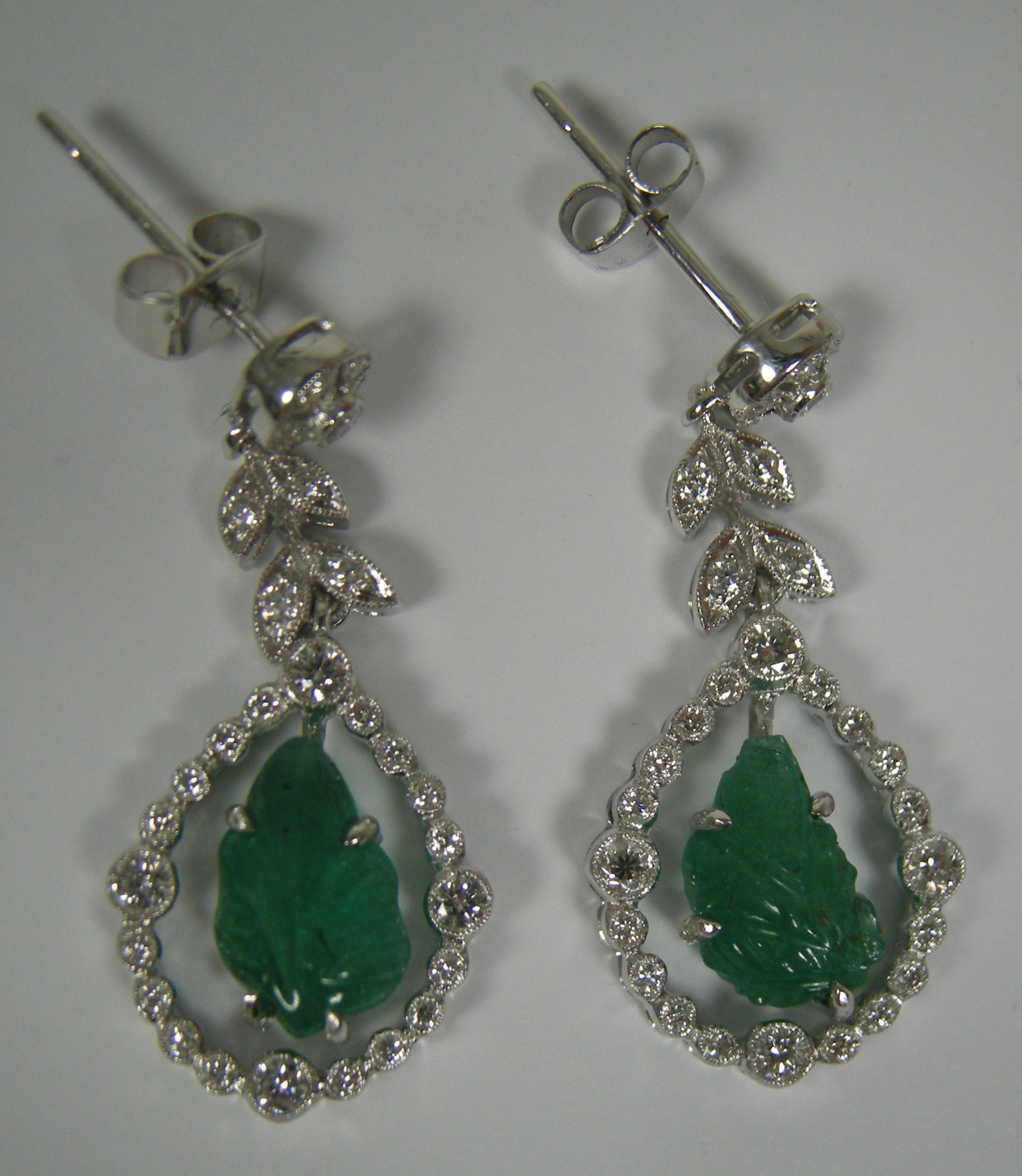 A pair of Belle Époque style emerald and diamond pendant earrings