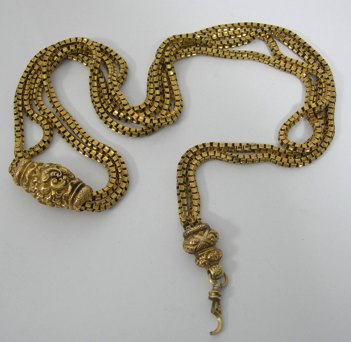 A Victorian gold long chain,