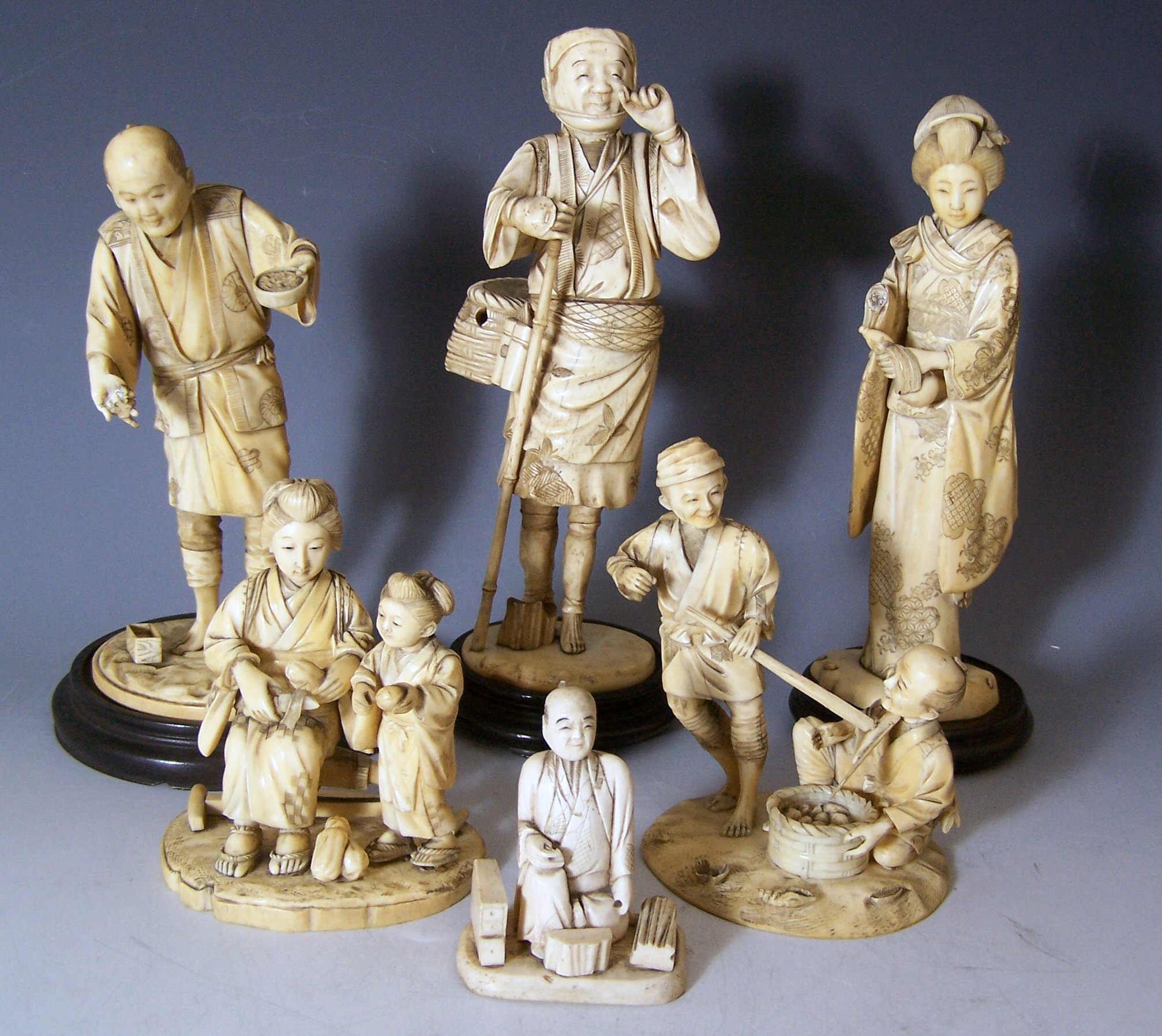 A collection of ivory figures,
