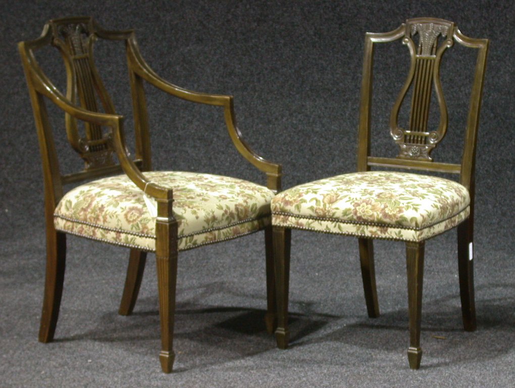A set of four Edwardian mahogany dining chairs,
